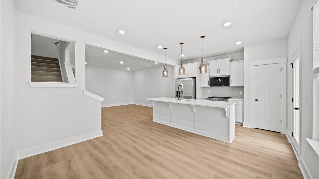 Tasteful dining area with current design in this vibrant two-story townhome