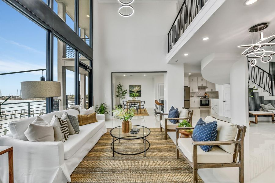 Living here means never choosing between comfort and the view. The spacious gathering area keeps the bay front and center while providing room for conversation, relaxation and entertaining. Living here means never choosing between comfort and the view. The spacious gathering area keeps the bay front and center while providing room for conversation, relaxation and entertaining.