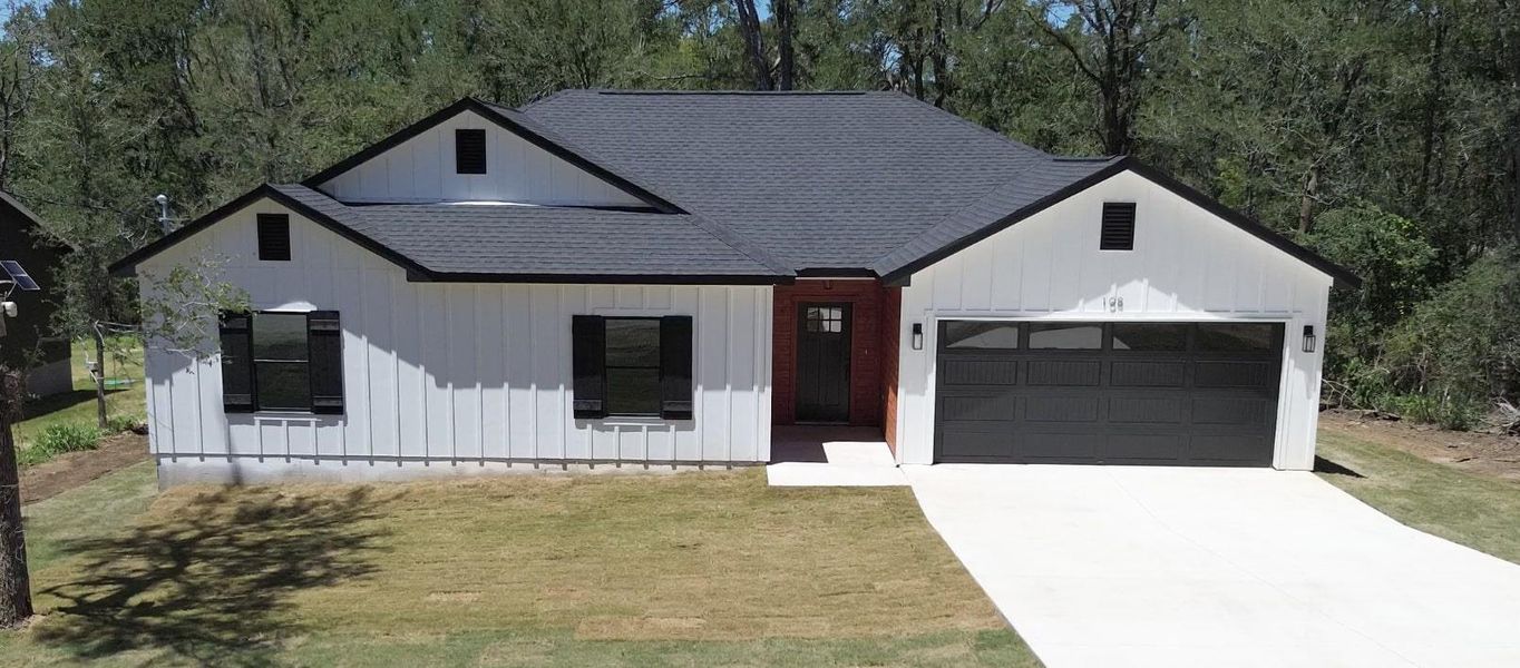 Front exterior of a new home in , Bastrop, TX, highlighting curb appeal (Image 18). Front exterior of a new home in , Bastrop, TX, highlighting curb appeal (Image 18).