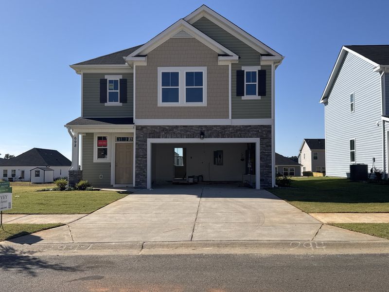 Front exterior of a new home in Windsor, North Augusta, SC, highlighting curb appeal (Image 1). Front exterior of a new home in Windsor, North Augusta, SC, highlighting curb appeal (Image 1).