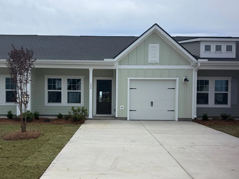 Front exterior of a new home in Blue Heron Retreat, Little River, SC, highlighting curb appeal (Image 1). Front exterior of a new home in Blue Heron Retreat, Little River, SC, highlighting curb appeal (Image 1).