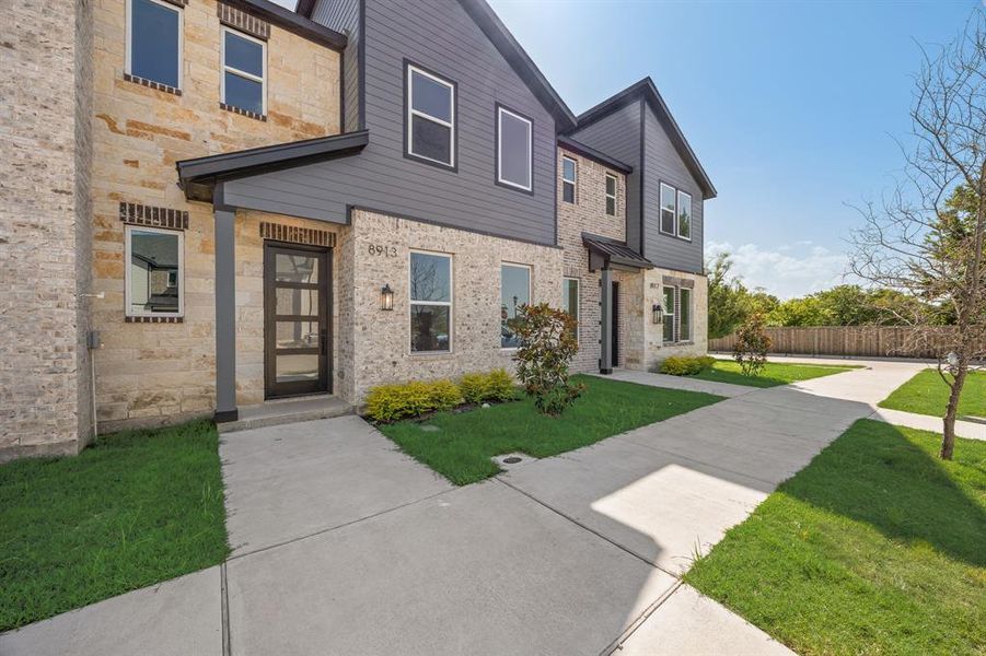 Front exterior of a new home in , Rowlett, TX, highlighting curb appeal (Image 1). Front exterior of a new home in , Rowlett, TX, highlighting curb appeal (Image 1).