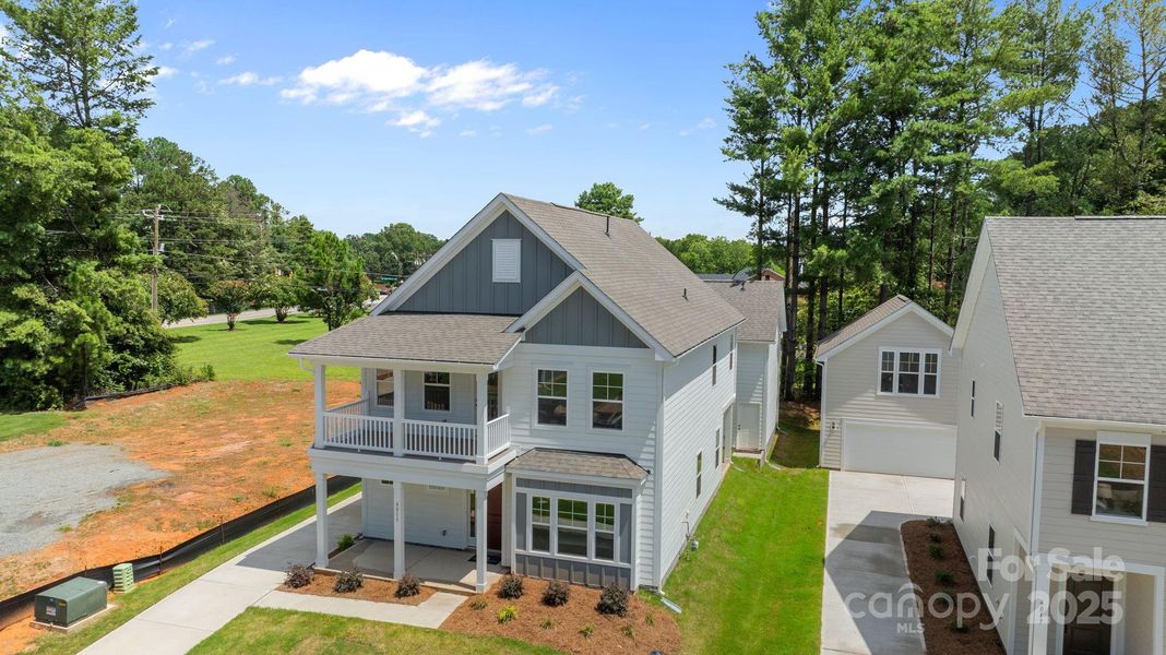 Front exterior of a new home in Arbor Village, Matthews, NC, highlighting curb appeal (Image 19). Front exterior of a new home in Arbor Village, Matthews, NC, highlighting curb appeal (Image 19).