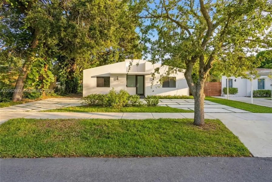 Front exterior of a new home in , South Miami, FL, highlighting curb appeal (Image 2). Front exterior of a new home in , South Miami, FL, highlighting curb appeal (Image 2).