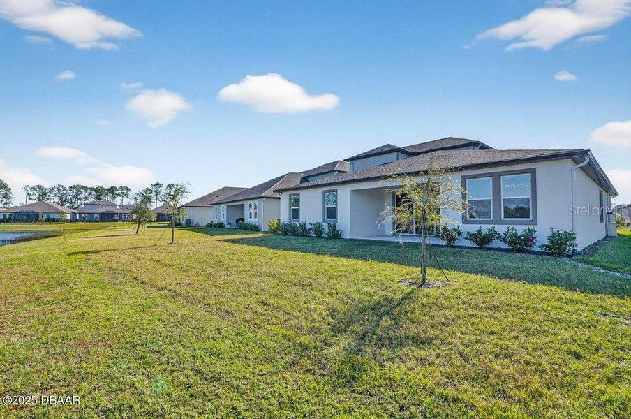 Exterior details and patio area of a home in Legends Preserve - Reserve Series, Daytona Beach (Image 25). Exterior details and patio area of a home in Legends Preserve - Reserve Series, Daytona Beach (Image 25).
