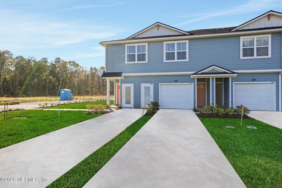 Front exterior of a new home in , Jacksonville, FL, highlighting curb appeal (Image 27).