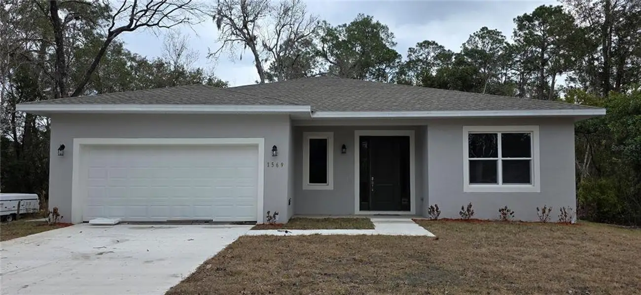 Front exterior of a new home in , Deland, FL, highlighting curb appeal (Image 2). Front exterior of a new home in , Deland, FL, highlighting curb appeal (Image 2).
