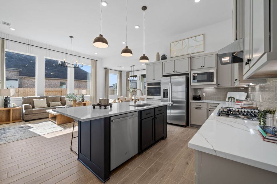 Representative furnished interior of a home built from the Bonneville by Chesmar Homes in University Heights, Round Rock (Image 7).