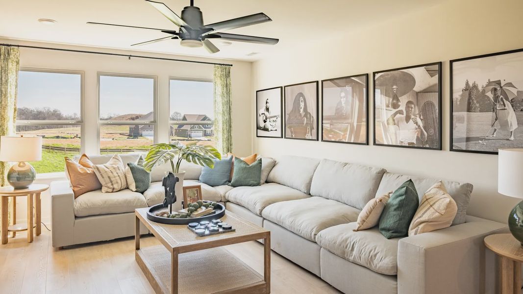 Bonus room loft area with large sofa and furniture for game and movie nights