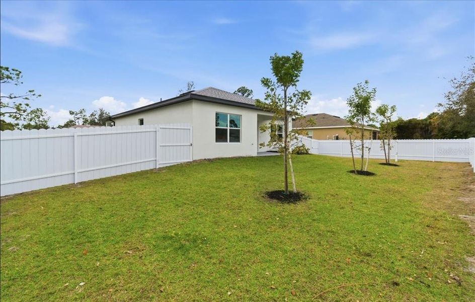 Exterior details and patio area of a home in , North Port (Image 39).