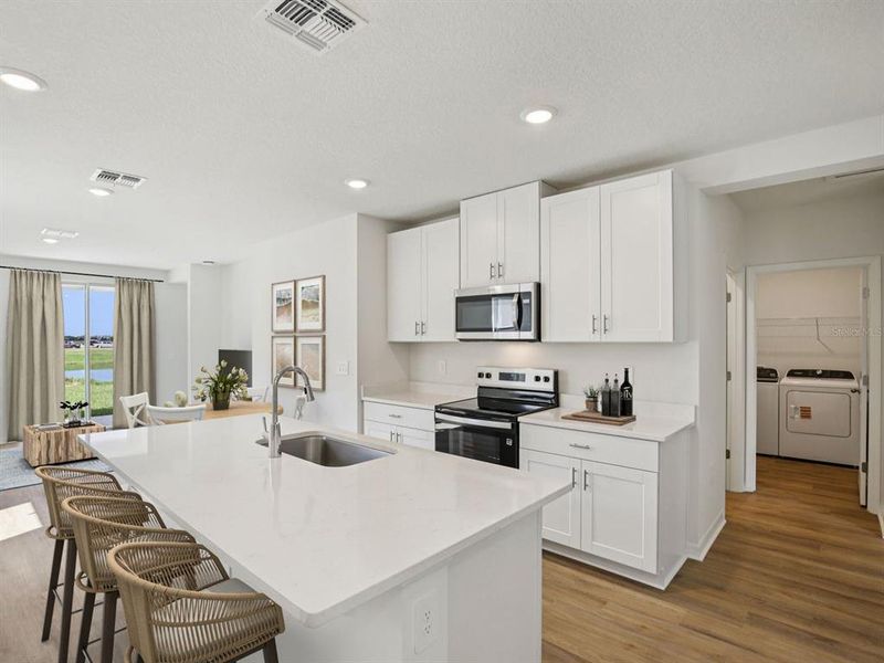 Furnished interior view inside a new home in The Grove at Stuart Crossing - Premier Series, Bartow (Image 10).