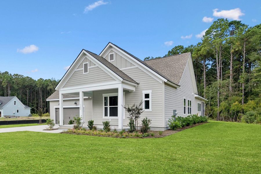 Front exterior of a new home in Hidden Ponds Reserve, Awendaw, SC, highlighting curb appeal (Image 26). Front exterior of a new home in Hidden Ponds Reserve, Awendaw, SC, highlighting curb appeal (Image 26).