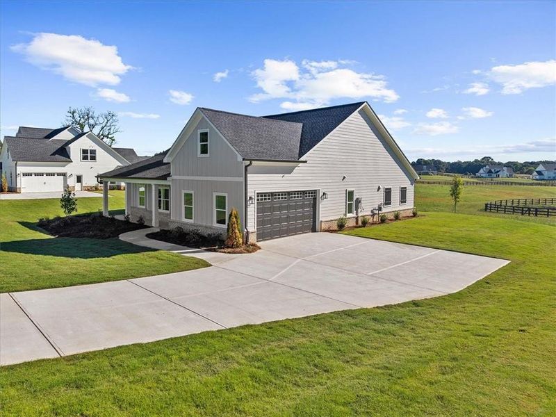 Front exterior of a new home in , Cumming, GA, highlighting curb appeal (Image 24).