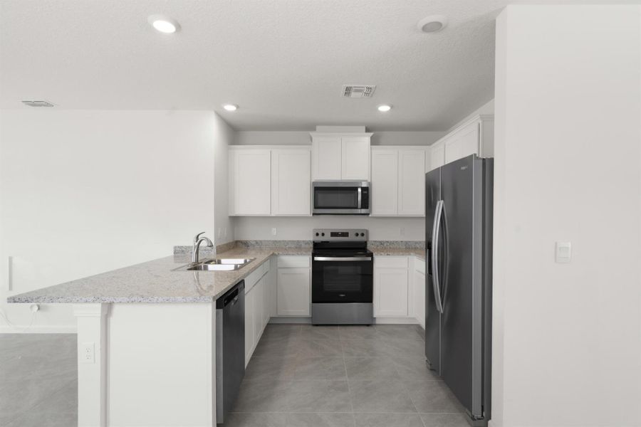 Furnished interior view inside a new home in Central Park 40s, Port St. Lucie (Image 5).