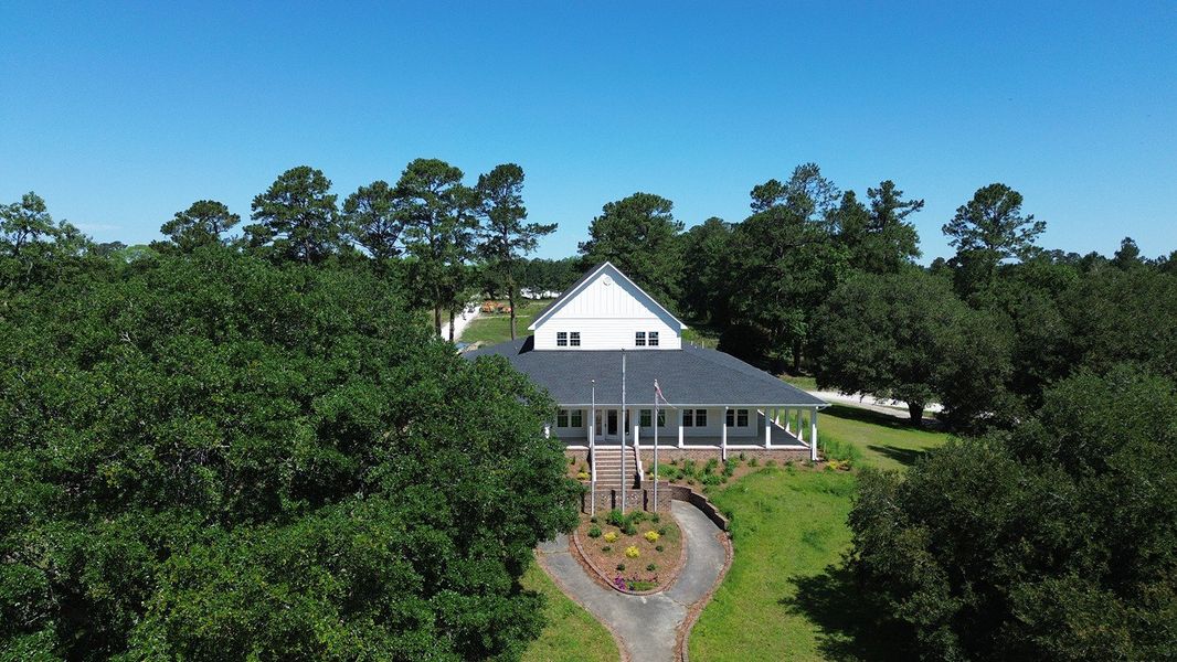 Front exterior of a new home in The Forest at Black Bear, Loris, SC, highlighting curb appeal (Image 2).