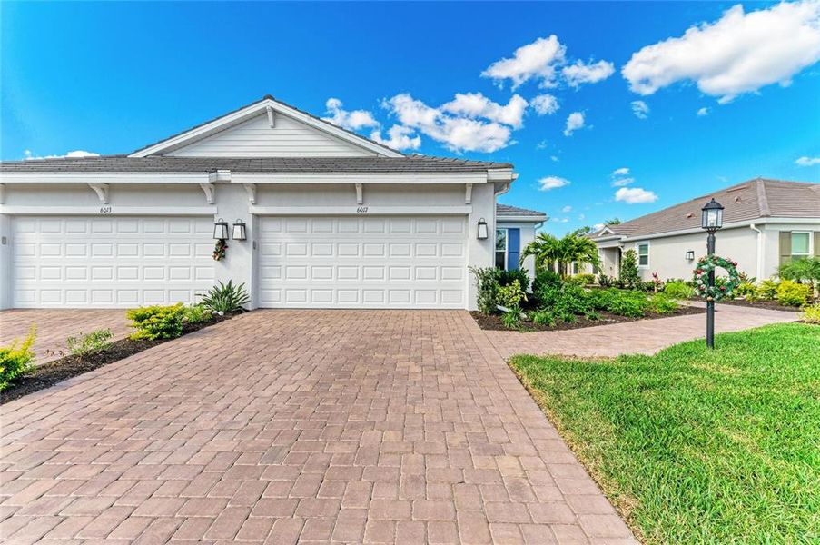 Front exterior of a new home in , Bradenton, FL, highlighting curb appeal (Image 21).