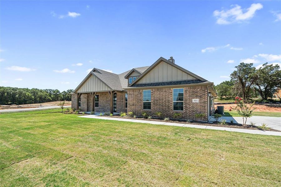 Front exterior of a new home in Oak Grove Addition, Springtown, TX, highlighting curb appeal (Image 21). Front exterior of a new home in Oak Grove Addition, Springtown, TX, highlighting curb appeal (Image 21).