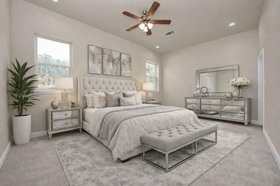 This spacious bedroom could serve as a second primary bedroom since it has its own en-suite bath. Two windows provide natural light, and a ceiling fan adds comfort. Also virtually staged.