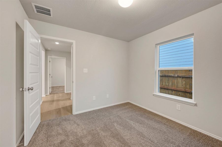 Spacious, unfurnished interior of a new home in Heritage, Dripping Springs (Image 14).