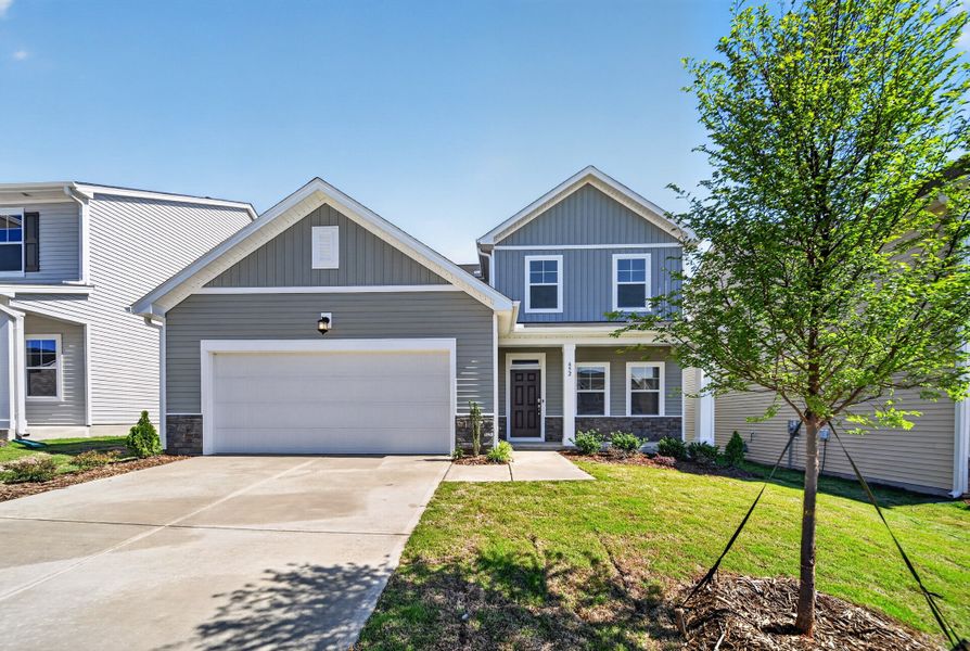 Front exterior of a new home in Sherri Downs, Angier, NC, highlighting curb appeal (Image 1). Front exterior of a new home in Sherri Downs, Angier, NC, highlighting curb appeal (Image 1).
