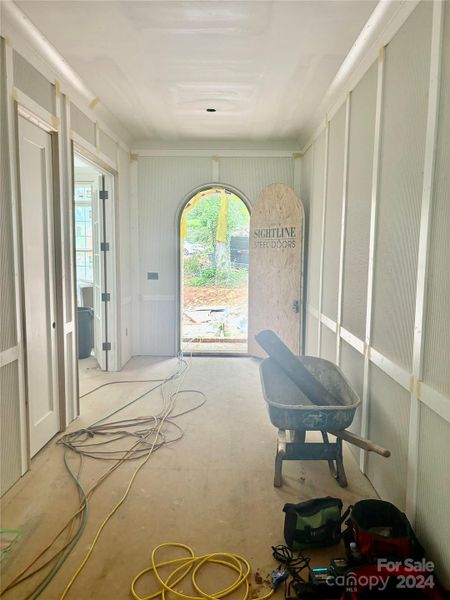 Foyer - front entry door will be an arched luxury steel door.