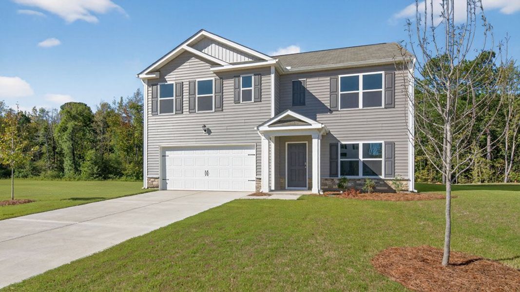 Front exterior of a new home in Olive Branch, Clayton, NC, highlighting curb appeal (Image 23). Front exterior of a new home in Olive Branch, Clayton, NC, highlighting curb appeal (Image 23).