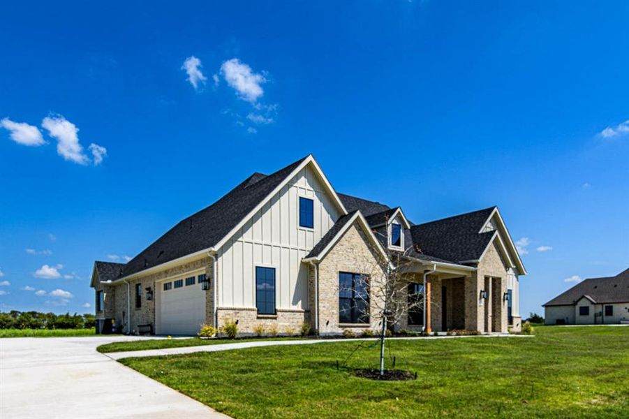 Front exterior of a new home in , Caddo Mills, TX, highlighting curb appeal (Image 21). Front exterior of a new home in , Caddo Mills, TX, highlighting curb appeal (Image 21).