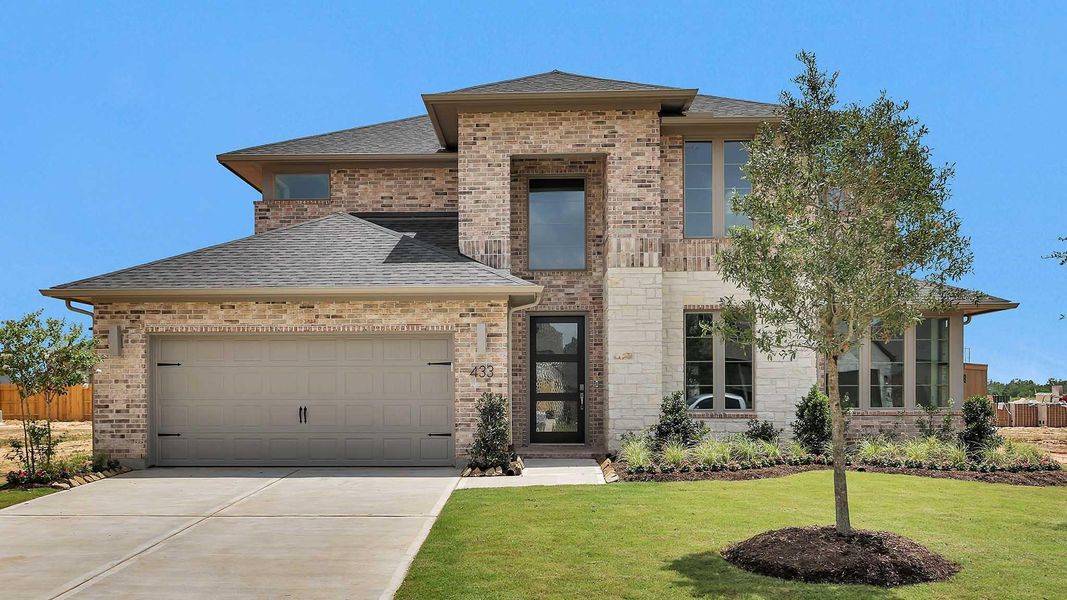 Front exterior of a new home in Grange 60', Katy, TX, highlighting curb appeal (Image 11).