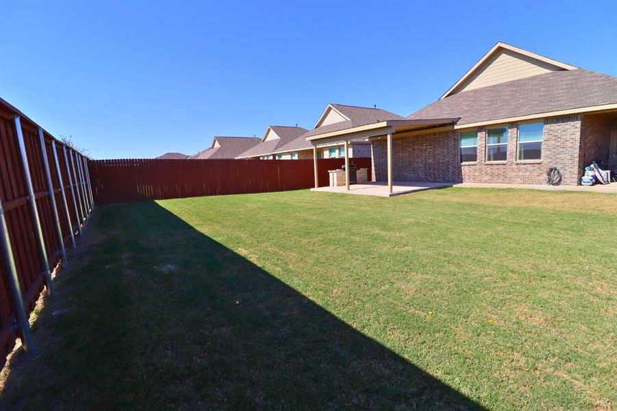 Exterior details and patio area of a home in Heartland: Classic Collection, Crandall (Image 1). Exterior details and patio area of a home in Heartland: Classic Collection, Crandall (Image 1).