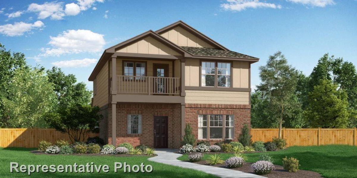 View of front of home featuring a balcony and a front lawn