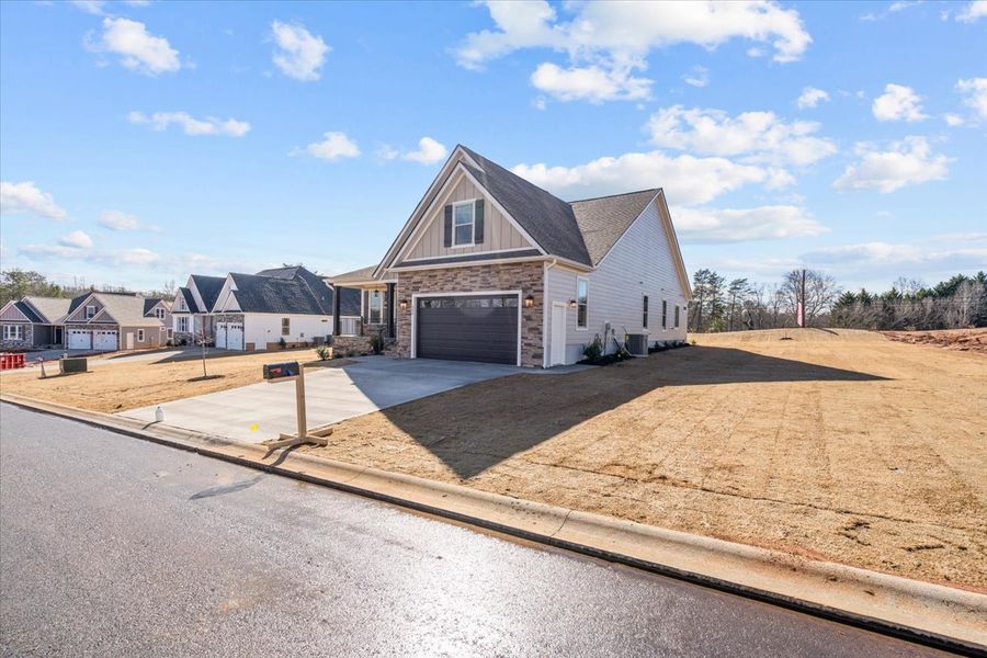Representative exterior photo of a completed home built from the Caterina Elite by Enchanted Homes in Tubbs Mountain Estates, Travelers Rest, SC (Image 2).