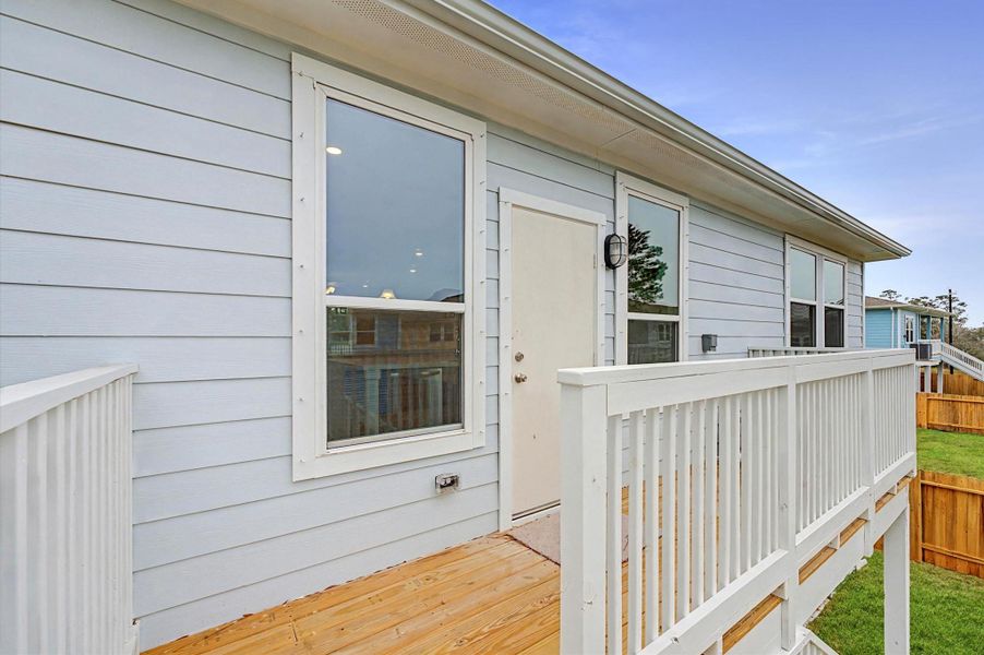 Exterior details and patio area of a home in Peacock Isle, Dickinson (Image 19).