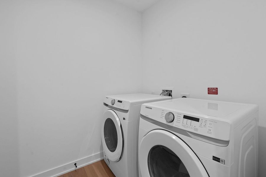 Representative Photo. Laundy room with Samsung washer and dryer included in unit