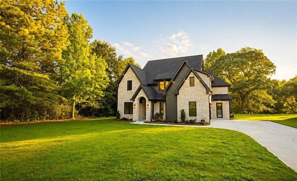 Front exterior of a new home in , Flowery Branch, GA, highlighting curb appeal (Image 26).