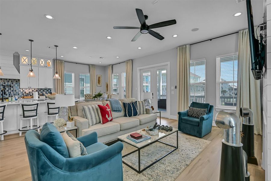 The open concept layout keeps the kitchen, dining, and living areas connected while still feeling spacious. Natural light pours throughout the entire main level.