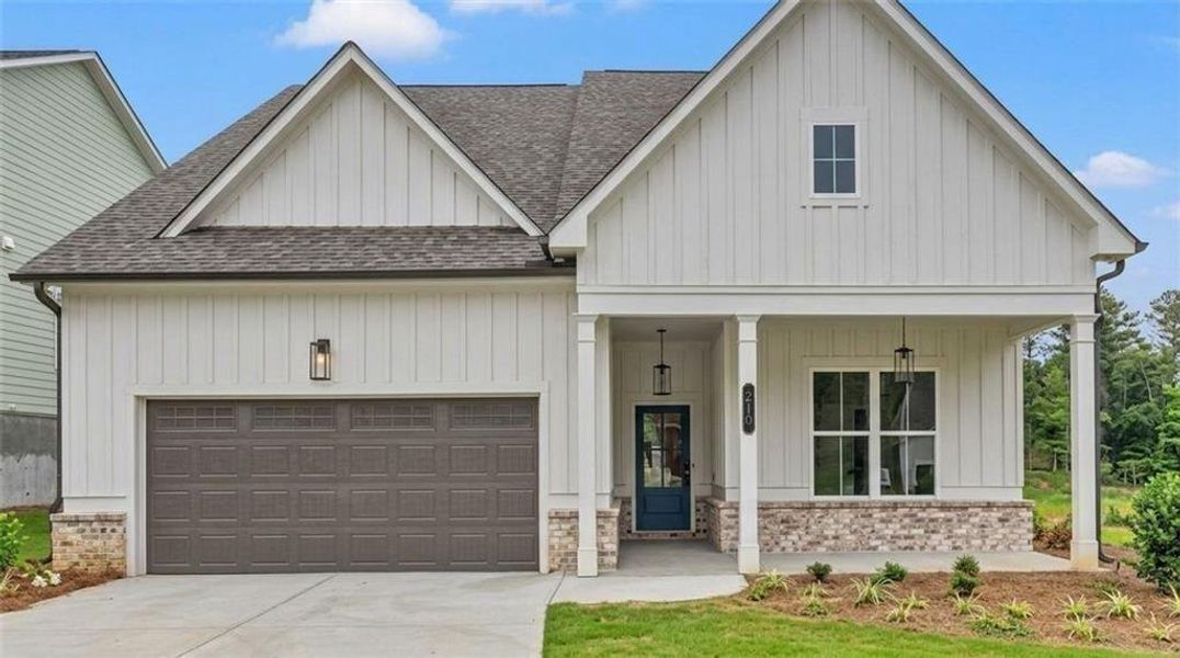 Front exterior of a new home in Cooks Farm, Woodstock, GA, highlighting curb appeal (Image 38). Front exterior of a new home in Cooks Farm, Woodstock, GA, highlighting curb appeal (Image 38).