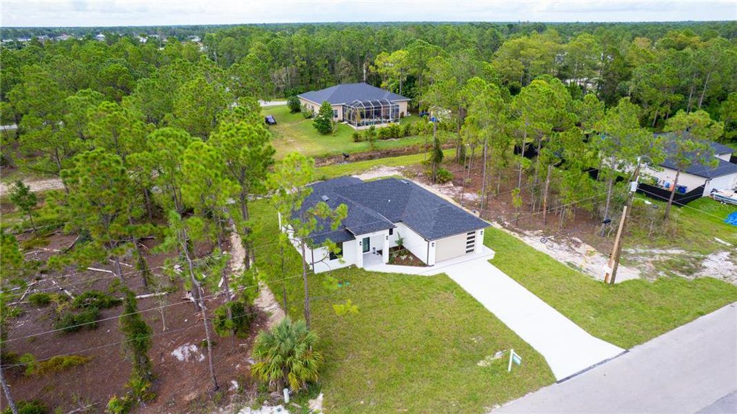 Front exterior of a new home in , Lehigh Acres, FL, highlighting curb appeal (Image 25).