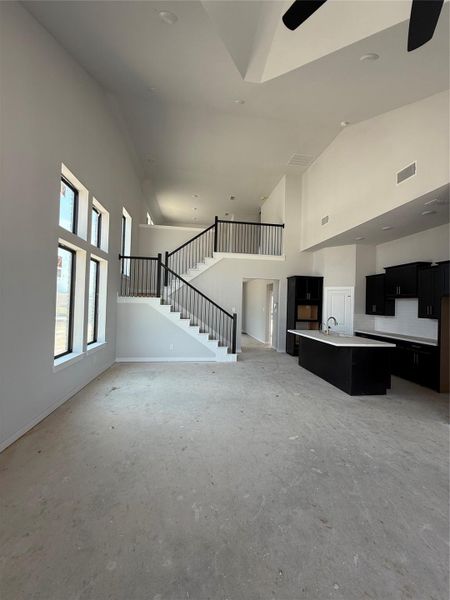 A window was added to the staircase for a little extra charm and character. This floor plan is wide open with ample light throughout.