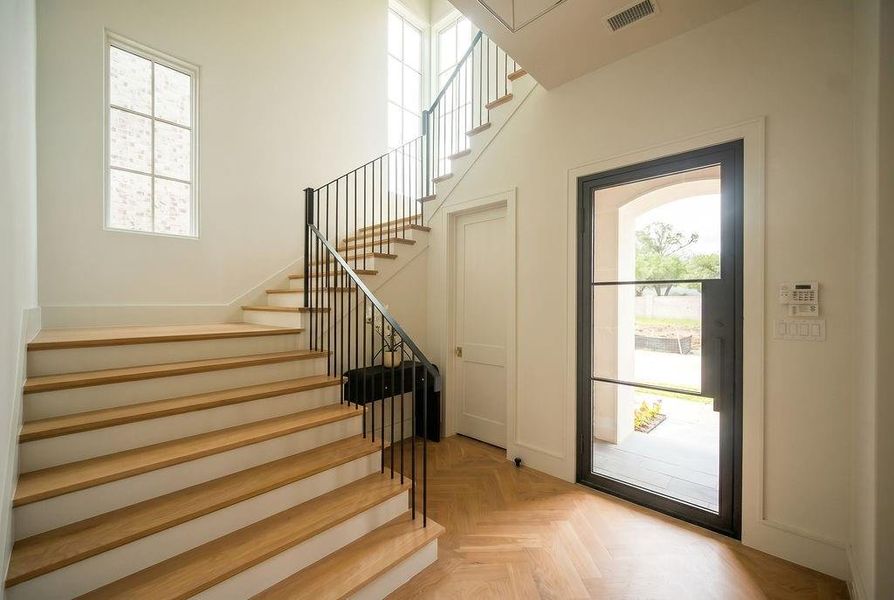 Entry with under staircase storage. Entry with under staircase storage.