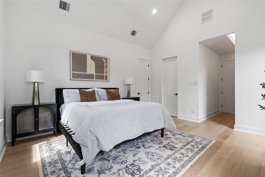 Composed beneath a vaulted ceiling, the primary suite reads like a quiet gallery—clean wall planes, discreet recessed lighting, and solid-core doors that heighten privacy. A short vestibule leads to a spa-level bath and custom wardrobe, while zoned, high-efficiency HVAC keeps the retreat hushed and perfectly tempered. Subtle, serene, and meticulously resolved. Composed beneath a vaulted ceiling, the primary suite reads like a quiet gallery—clean wall planes, discreet recessed lighting, and solid-core doors that heighten privacy. A short vestibule leads to a spa-level bath and custom wardrobe, while zoned, high-efficiency HVAC keeps the retreat hushed and perfectly tempered. Subtle, serene, and meticulously resolved.