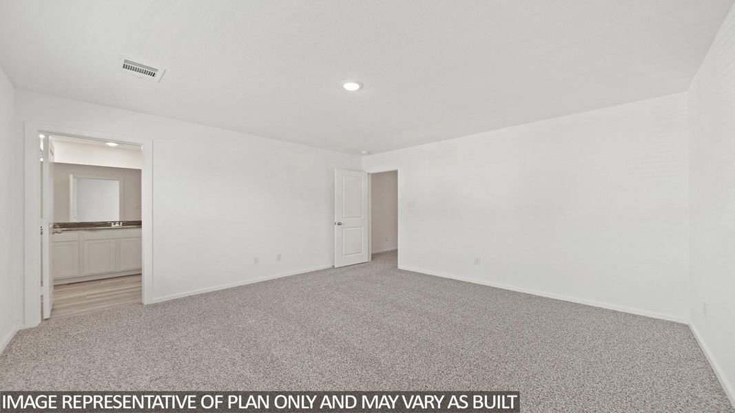 Spacious interior room with light gray carpeting and white painted walls