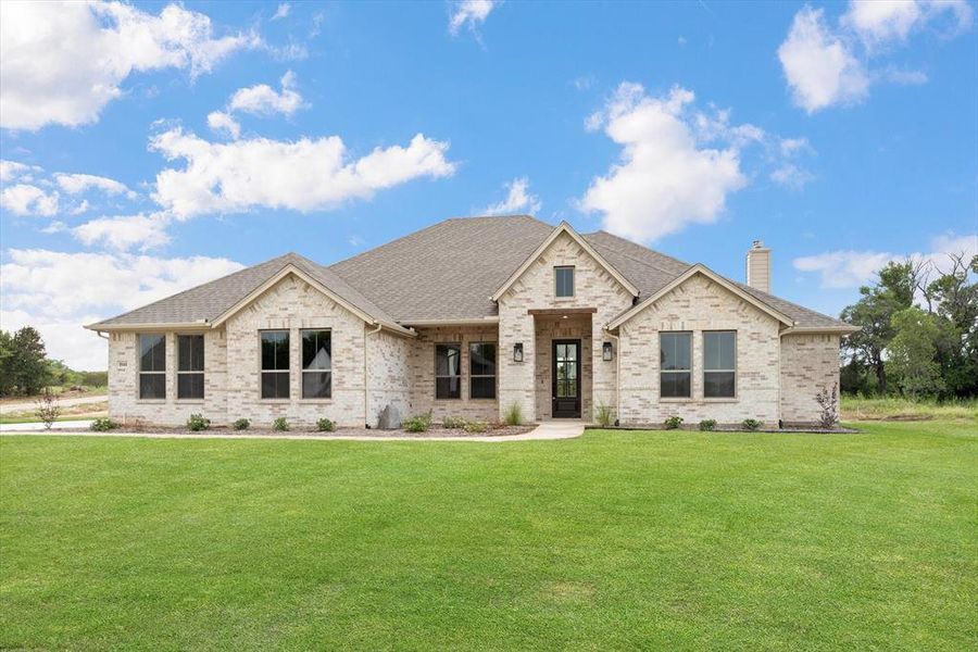 View of front of house with a front lawn