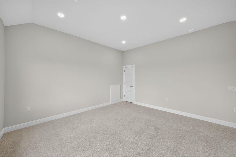 Carpeted empty room with recessed lighting Carpeted empty room with recessed lighting