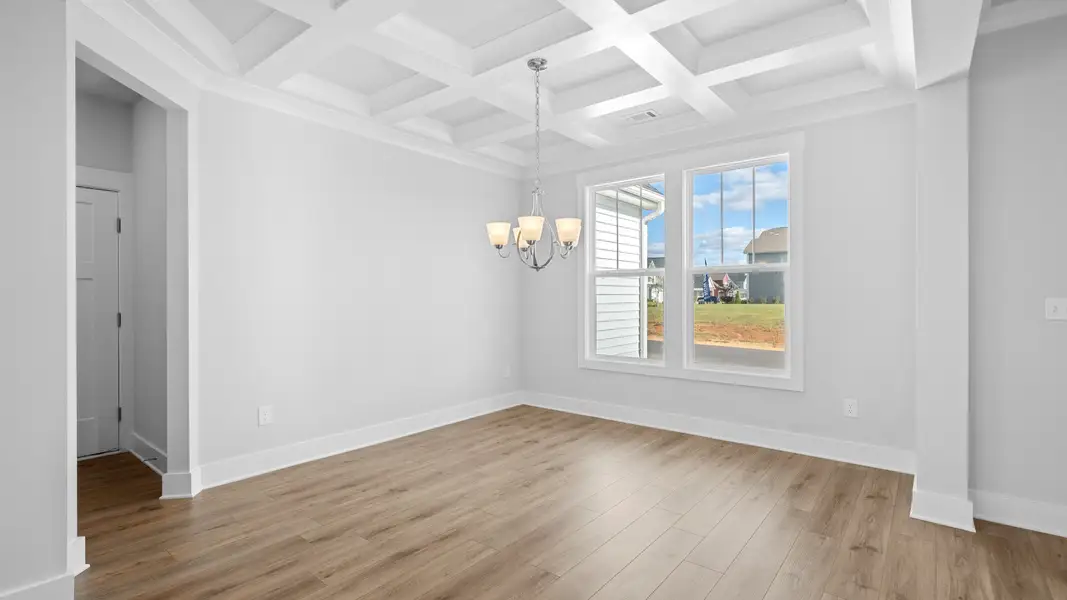 2 story single family home, all white, dining room