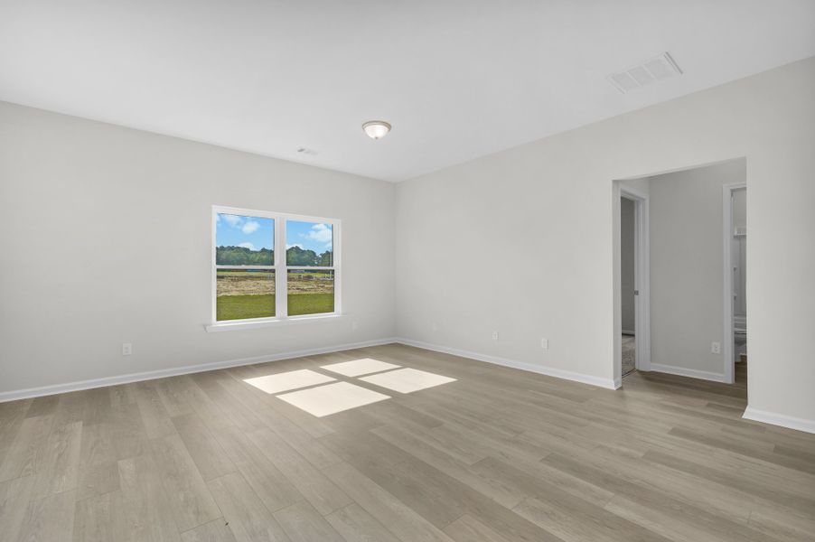 Representative unfurnished interior of a home built from the The Magnolia by Smith Family Homes in Lakeview Pines, Statesboro (Image 26).