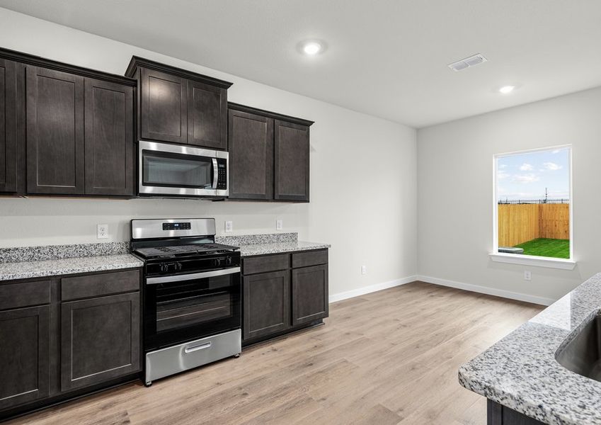 The dining room sits right off of the kitchen. The dining room sits right off of the kitchen.