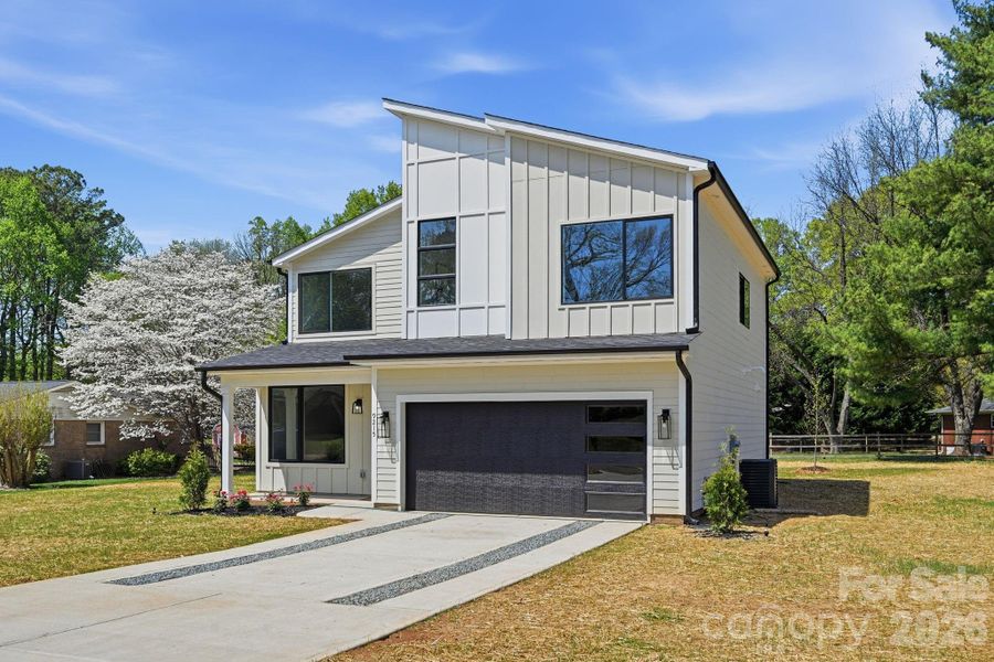 Front exterior of a new home in , Huntersville, NC, highlighting curb appeal (Image 24).