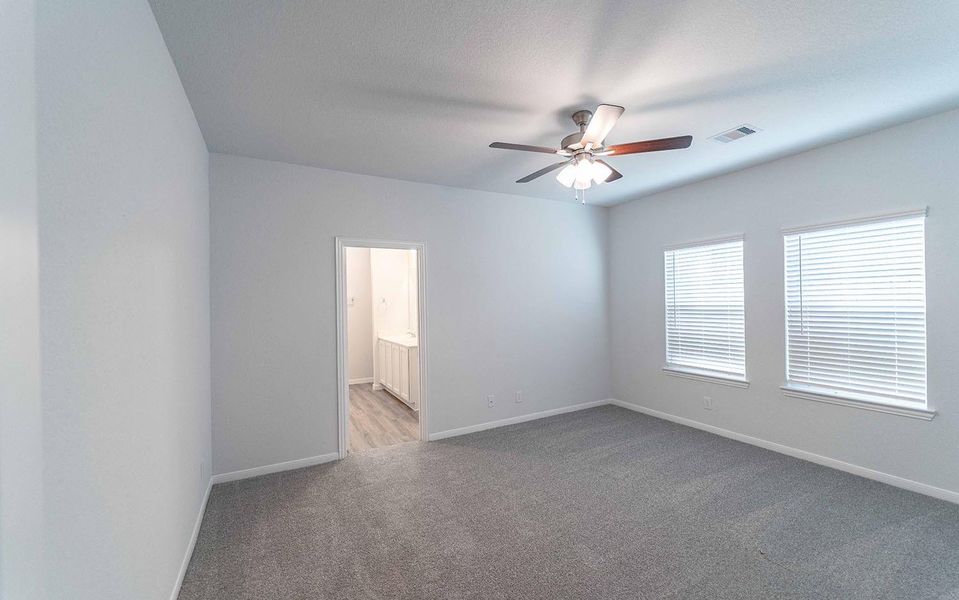 Spacious, unfurnished interior of a new home in The Pines at Seven Coves, Willis (Image 8).
