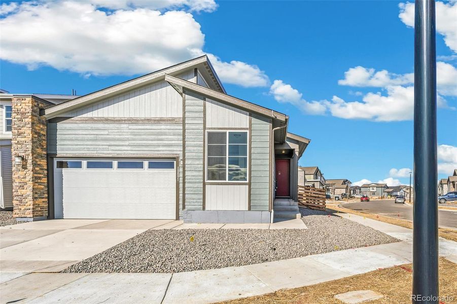 Front exterior of a new home in Legato, Commerce City, CO, highlighting curb appeal (Image 19).
