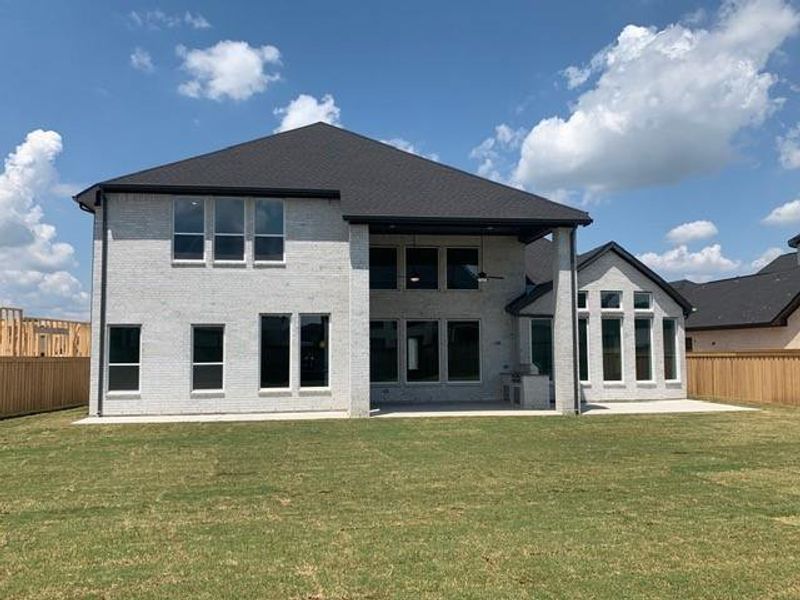 Exterior details and patio area of a home in Dunham Pointe, Cypress (Image 27).